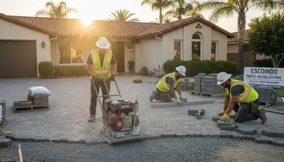 Professional crew installing driveway pavers in Escondido, CA for Chop Chop Landscaping